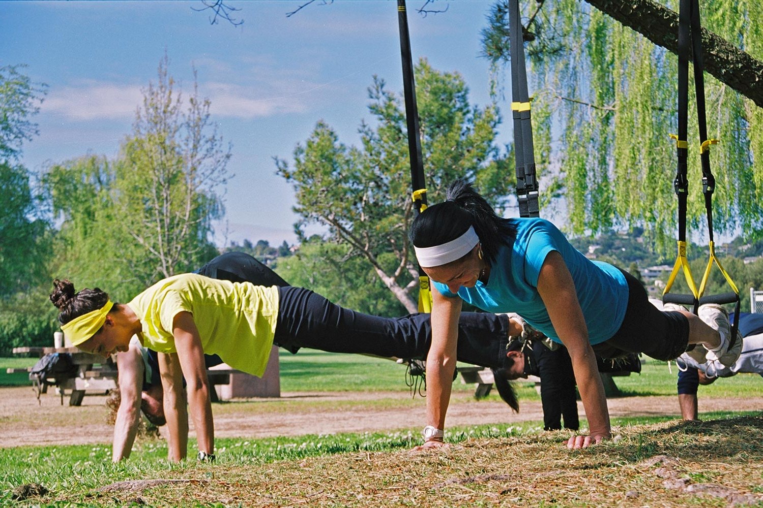 Group fitness classes with Beyond Fitness, using TRX suspension trainers